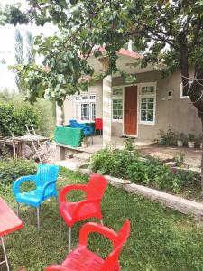 a group of chairs in front of a house at Stone Leaf Retreat - Skardu in Skardu