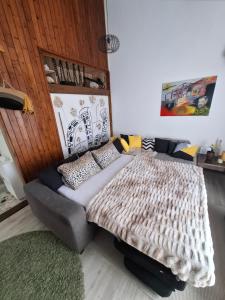 a bedroom with a bed and a couch at Peaceful retreat beach in Zaton