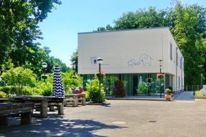 a building with an elephant on the side of it at Gästehaus Gothensee in Heringsdorf +8 photos