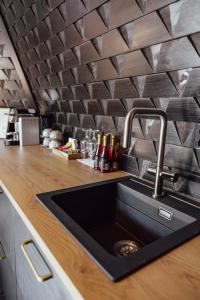 a kitchen with a sink and a counter top at Aurora Village Ivalo in Ivalo +150 photos