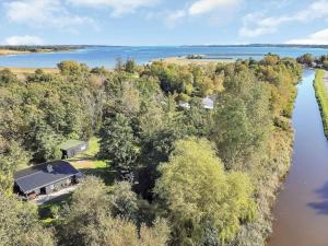 an aerial view of a house next to a river at 14231-1-Grevinge-Kirsebaerhaven-18 in Grevinge