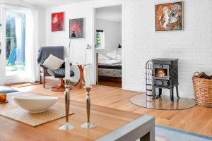 a living room with a wood stove in it at 14231-1-Grevinge-Kirsebaerhaven-18 in Grevinge