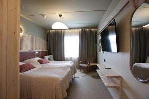 Postel nebo postele na pokoji v ubytování Hotel Inari + 44 fotografií