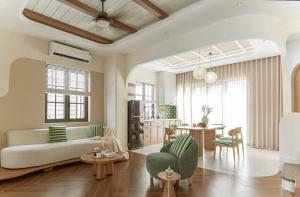 a living room with a couch and a table at VILLA NOVAWORLD PHAN THIET Beach in Phan Thiet