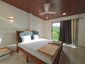 a bedroom with a large bed and a window at Mermaid Avisa in Arambol +31 photos