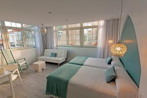 Кровать или кровати в номере Hotel Alda Puerta Del Sol