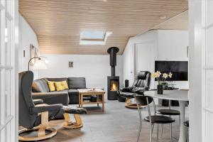 a living room with a couch and chairs and a table at LF12172-Vinderup-Strandlyst-29 in Vinderup