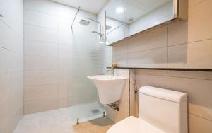 a bathroom with a toilet and a sink at Y2 Stay Hotel in Sokcho +28 photos