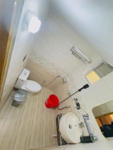 a bathroom with a sink and a toilet in a room at Arham Beach Resort in Cox's Bazar