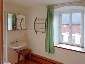 a bathroom with a sink and a window at Ferienwohnung Bieber in Seiffen