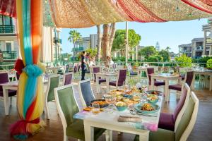 a table with plates of food on top at TUI MAGIC LIFE Masmavi in Belek