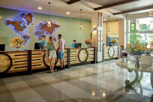 a group of people standing in a lobby at TUI MAGIC LIFE Masmavi in Belek +140 photos
