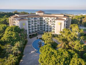 an aerial view of a hotel with the ocean in the background at TUI MAGIC LIFE Masmavi in Belek