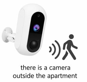 a camera attached to a wall with a sign that reads there is a camera outside at Twins Apartments 2 in Serres