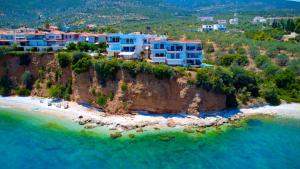 an aerial view of a beach with houses on a cliff at Apartment Xenia in Xiropigado