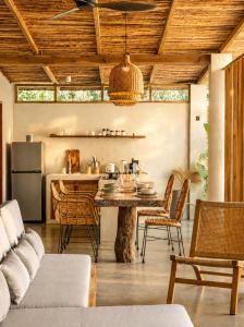 a kitchen and dining room with a table and chairs at HAMA Villa with private pool in El Nido