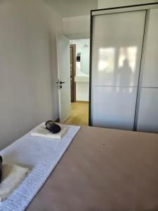a room with two beds and a sliding glass door at Apartman Marija IV in Vrnjačka Banja +13 photos