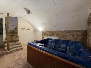 a kitchen with a blue sink in a room at Casa Nabarro in Iturgoyen +28 photos