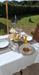 a table with plates of food on top of it at Stazzu La Vigna Di Maria in Aglientu +12 photos