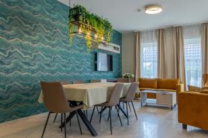 a dining room with a table and chairs at Luca Villa in Balatonlelle