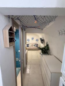 a hallway with a room with a bed in it at Maja cuore blu in Vieste