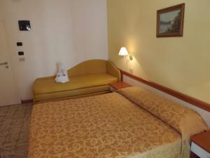 Postel nebo postele na pokoji v ubytování Hotel Vasco