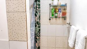 a bathroom with a shower with a shower curtain at Auki Ocean View in Auki