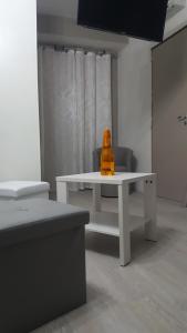 a yellow object sitting on a white table in a room at La Casa Dei Sogni in Gallico