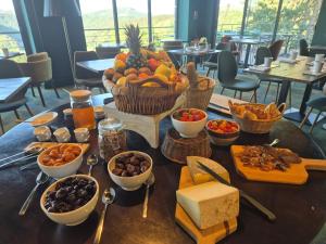 a table with a bunch of food on it at Le Panoramic Garabit in Anglards-de-Saint-Flour