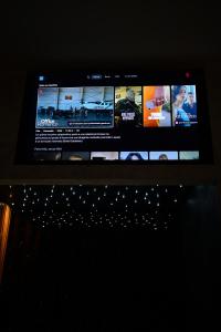 a flat screen tv sitting on top of a table at ASTRUM b&b in Cosenza
