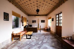 a living room with a couch and a table at Aangan Resort Mandawa in Mandāwa