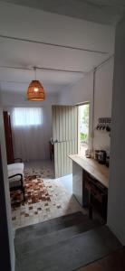 a room with a table and a bed and a window at Hope's Harvest Nook in Montagu