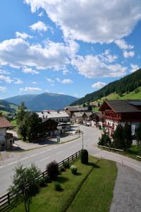 an empty street in a small town with a mountain at Haus Bodner in Kartitsch