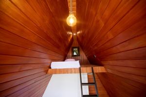 a sauna with a ladder in a wooden room at Area 51 Arugambay in Arugam Bay