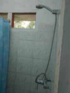 a shower in a bathroom with a window at Kathy B Guesthouse in Luganville +71 photos
