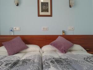 Posteľ alebo postele v izbe v ubytovaní Hostal Campus