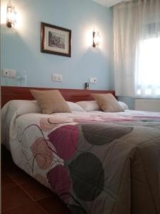 Posteľ alebo postele v izbe v ubytovaní Hostal Campus