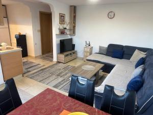 a living room with a couch and a table at Liza Apartment in Ulcinj