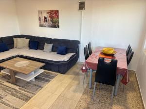 a living room with a couch and a table at Liza Apartment in Ulcinj