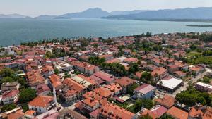 an aerial view of a town next to the water at Ermet Homes Apart in Koycegiz