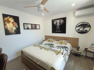 a bedroom with a bed with animals on it at " LE CHABASSOLE " CHAMBRES D'HÔTES - GORGES du VERDON in Aiguines