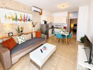 a living room with a couch and a table at Castello rezidence Korcula 2 in Korčula