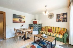a living room with a couch and a table at LIDA CHALET in Längenfeld