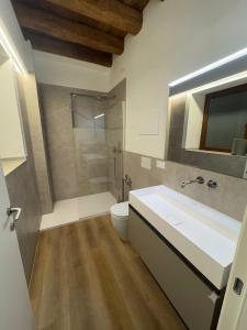 a bathroom with a shower and a sink and a toilet at Agriturismo Al Capretto in San Vendemiano +24 photos