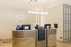 an office with two counters with computers on them at B&B HOTEL Zaragoza Los Enlaces Estación in Zaragoza