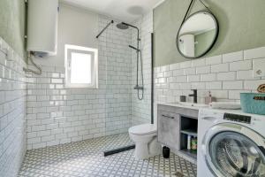 a bathroom with a toilet and a washing machine at Calm apartment in Lepetane in Tivat +34 photos