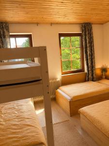 a bedroom with two bunk beds and a window at Manna Haus in Gelnhausen