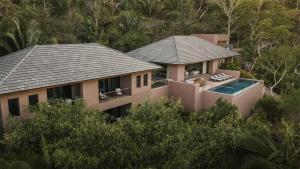 an aerial view of a house with a swimming pool at One&Only Mandarina in Lo de Marcos