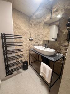a bathroom with a sink and a mirror at Hotel La Romantica in Mladá Boleslav +29 photos