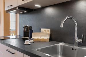 a kitchen counter top with a sink and a counter top at Gatterpunerhof in Vols am Schlern +43 photos
